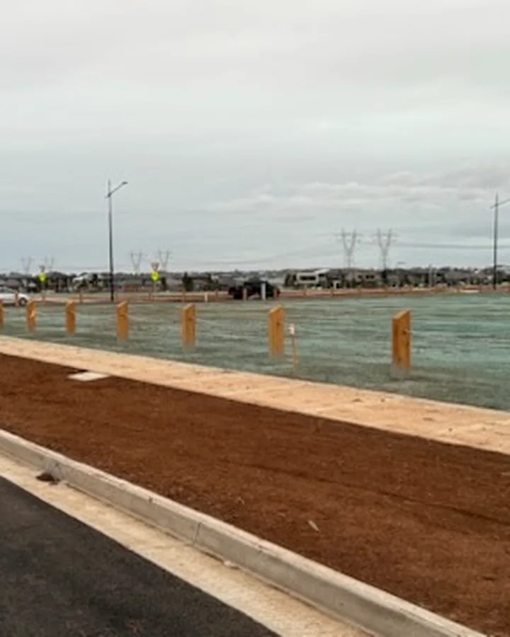 Timber bollards and rope running beside a new pedestrian path