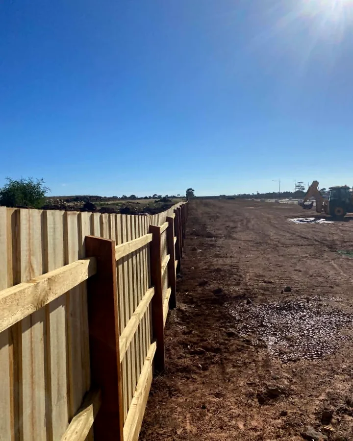 Timber boundary fencing installed along an active development site
